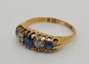 A Victorian 18ct. gold, sapphire and diamond five stone ring, Birmingham 1897, set three graduated