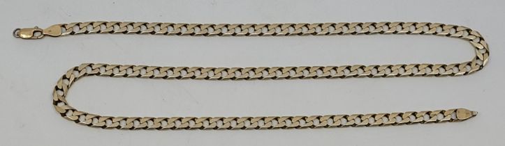 A 9ct. gold flat curb chain, length 59cm (as found). (30.2g)