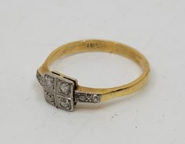 An Art Deco style 18ct. gold and diamond ring, having square mount to centre set four eight-cut