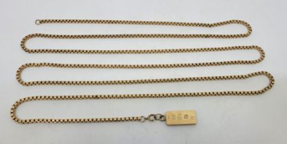 A 9ct. gold pendant ingot, London 1976, suspended from a long 9ct. gold box link chain, length