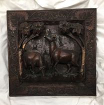 An Asian carved wooden wall hanging, 45.5cm x 46cm