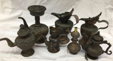 A collection of Sino-Tibetan items to include Sino-Tibetan copper jugs (some a/f)