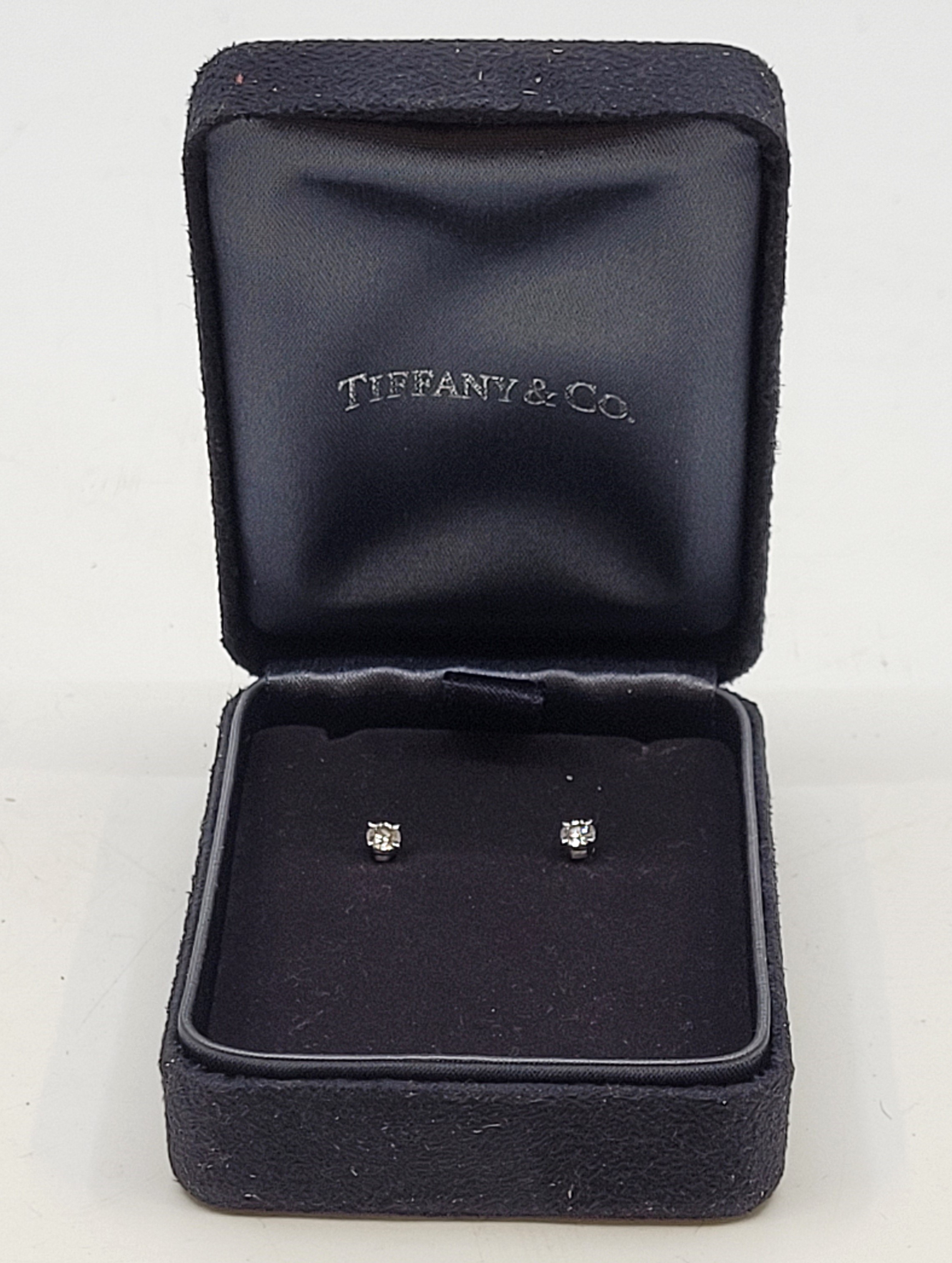 A pair of Tiffany & Co platinum diamond stud earrings, each set single round brilliant cut - Image 2 of 4