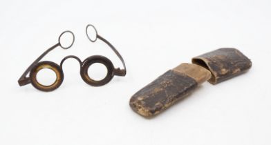 A pair of 18th-century spectacles or "Visual Glasses", the wide horn margins suggestive of London'