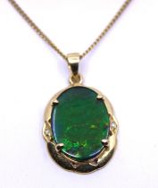 14ct Yellow Gold Opal Triplet Pendant and 9ct Yellow Gold Curb Link Fine Chain. The Oval Opal