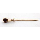 Unmarked Yellow Metal Oval Brilliant Cut Amethyst Stick Pin. The Oval Brilliant Cut Amethyst