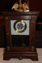 19th century chiming mantel clock with eagle top and copper plate detail to case, pendulum