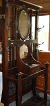 Large hall coat stand with draw and central mirror.