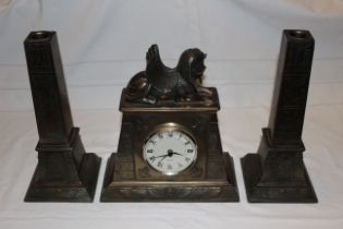 Modern heavy resin Egyption styled mantel clock with 2 x candle stick garnitures, movement is