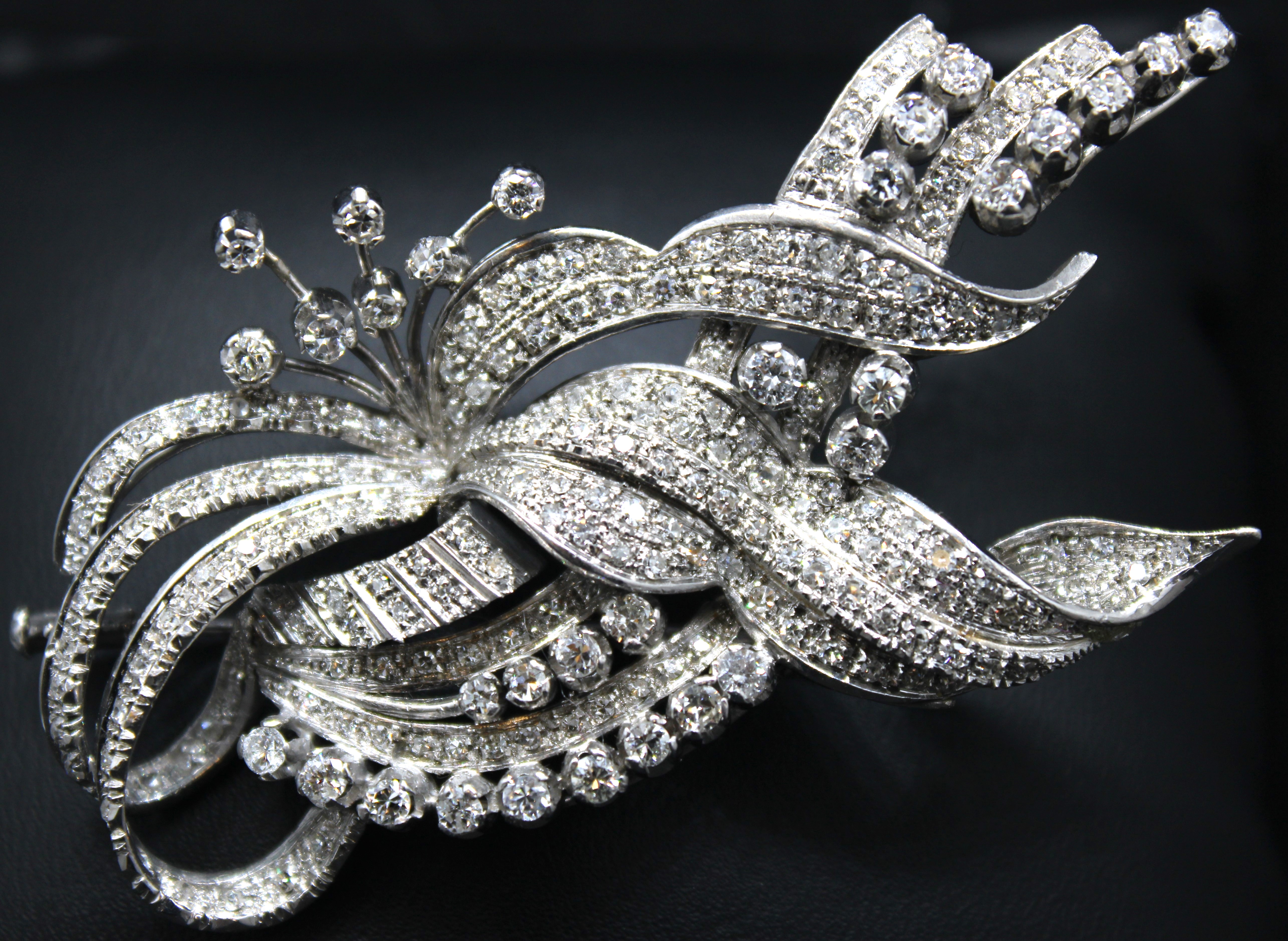 Unmarked white metal Diamond Floral Spray Brooch. Approx. 2.50ct total diamond weight.  Contains