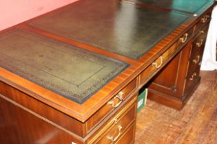 A late 20th century leather topped mahogany twin pedestal desk. 160cm wide, 87cm deep, 76cm high. (