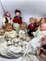 Antique and Antique dolls to include an unusual celluloid head a character baby in romper 15’