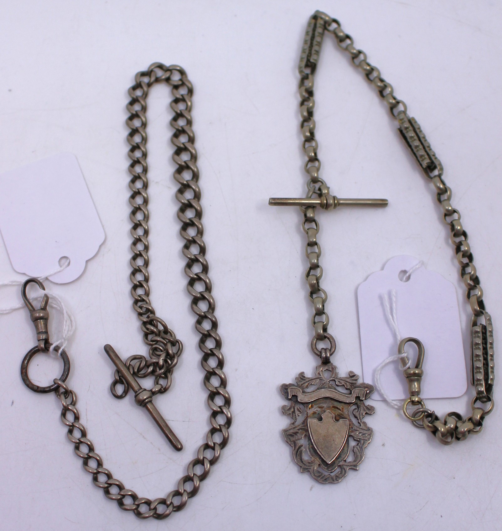 One Sterling Silver Albert chain with dog clip (damaged) and an unmarked white metal watch chain