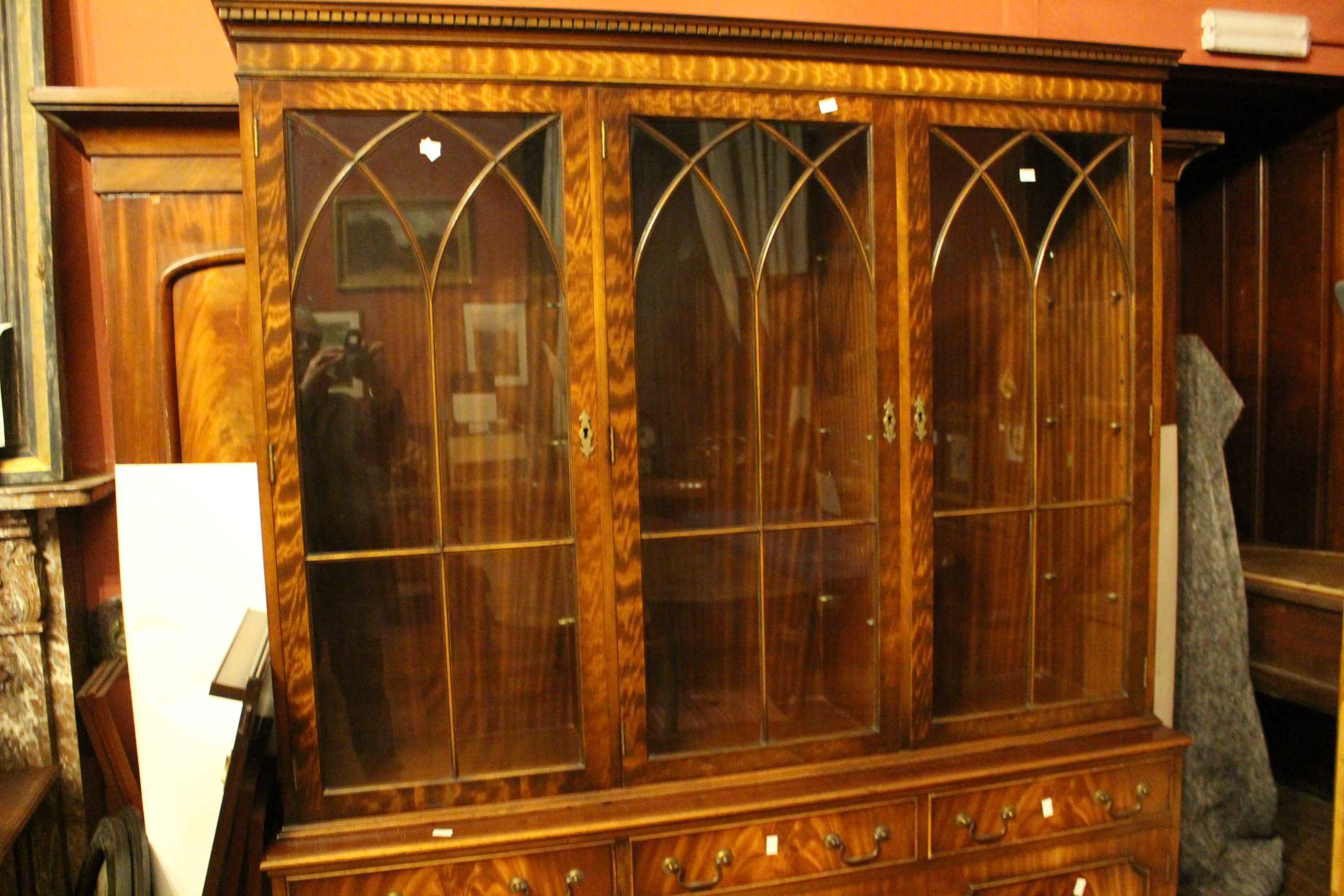 A 20th century flame mahogany triple cabinet with glazed doors over drawers and cupboards. 145cm - Image 3 of 3