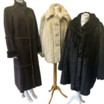 A grey shearling 3/4 length coat with horn toggle fastening, SZ M, a full length chocolate brown