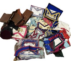 A large quantity of masonic regalia including aprons, sashes and masonic cuffs, many appearing