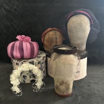 A group of mixed era vintage handbags and hats plus two hat boxes to include a brown birdcage veil