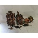 2 Black Forest style wall mounted cuckoo clocks one also being musical together with a small novelty