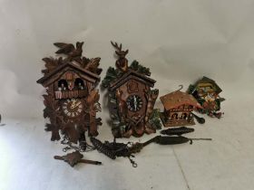 2 Black Forest style wall mounted cuckoo clocks one also being musical together with a small novelty