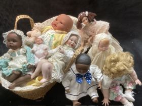 Vintage Artist Modern Porcelain and vinyl collection of dolls and baby dolls all dressed in a