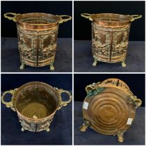 A 19th Century Dutch Repoussé Copper and Brass Jardinière.  Decorated in the round with four