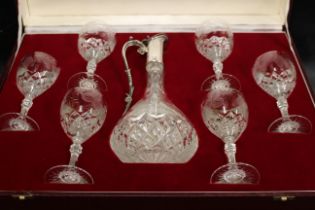 A set of six wine glasses with diamond cut band and etched with fruiting vine and the matching