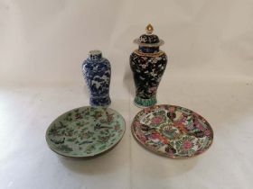 A Famille noir lidded vase 32cm high, together with a blue and white chinese vase signed underneath,