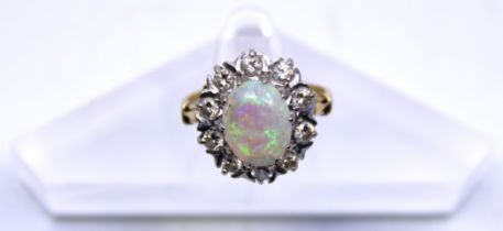 18ct Yellow Gold Opal and Diamond ring.  The Oval Cabochon Opal measures approx. 10mm x 8mm.