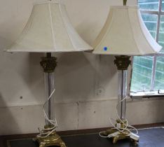 A pair of glass and brass imitation table lamps with shades, approximately 78cm high each.