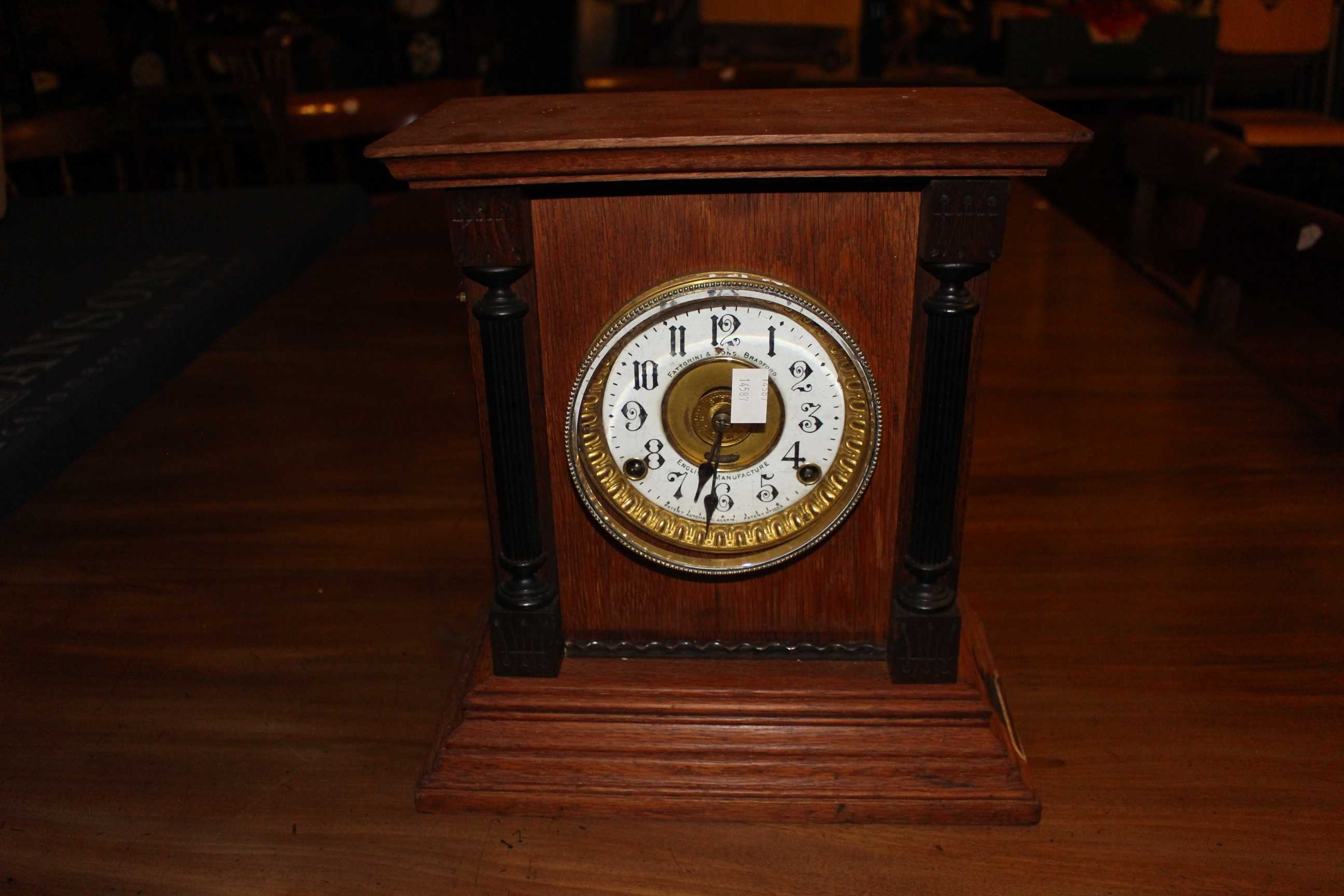 Antique Thomas Fattorini & Son Two train mantel clock with alarm facility, enamel face but small