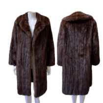 Two vintage coats to include one mid-length dark and glossy mink with lapels and furrier hook