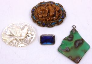 A Chinese Silver Gilt, Enamel and carved Quartz; Variety Tigers Eye brooch, a Chinese Mother of