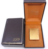 Gold Plated St. Dupont Lighter Boxed with Repair Guarantee and Booklet.  The lighter states St.