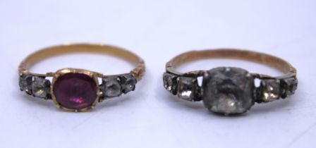 Two Unmarked Yellow Metal Georgian rings.  One of the rings has colourless stones. The centre