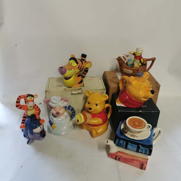 A collection of collectable teapots relating to Winnie The Pooh to include; A Cardew Design Disney