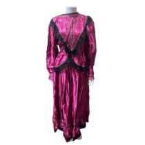 A selection of 17 vintage women's theatrical costume dresses, including victorian style inside a