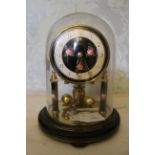 A Roma of Germany 400 day clock under glass dome, together with thermometer. Clock with 3" dial