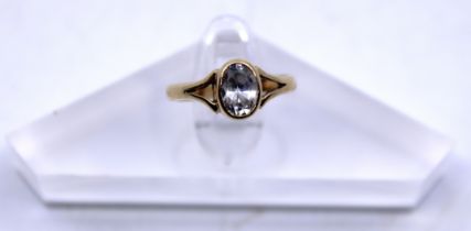 9ct Yellow Gold Colourless Paste Stone Dress ring.  There is an Oval Brilliant Cut Colourless