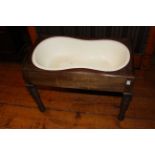 Victorian Baby bath on turned legs with Wedgwood insert, cover not present.