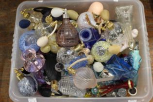 A quantity of glass scent and perfume bottles, some with perfume still in, to include Caithness