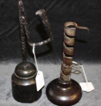 An 18th/19th century iron "rat de cave" spiral candlestick, with ejector, on turned wood base,
