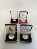 United Kingdom Silver Proof coins to include; A WW2 Peace commemorative £2 coin, a Falklands
