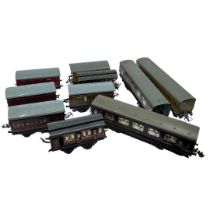 A collection of vintage Hornby O Gauge passenger carriages including an LMS 6844 and LMS 3888