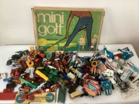 Large selection of Vintage toy cars and vehicles and a large range of Transformer old vintage toys