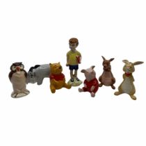 A collection of vintage Beswick 'Winnie the Pooh' Disney figures to include: Winnie, Piglet, Eeyore,