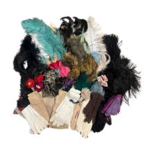 A box of millinery feathers and flowers along with a number of pairs of gloves including unworn