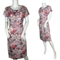 A 1950s Ceil Chapman dress with hydrangea print. The dress has short sleeves and a long metal zipper