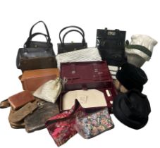 A collection of vintage handbags, purses and hats to include a 1950s knotted metal framed bag, a red