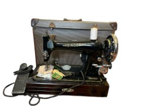 A 1950s singer sewing machine in case, model number on plaque R 192 869, untested (1)