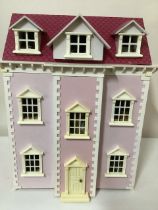 Wooden vintage rose pink dolls house with furniture and dolls house doll measures 27” high x 22”